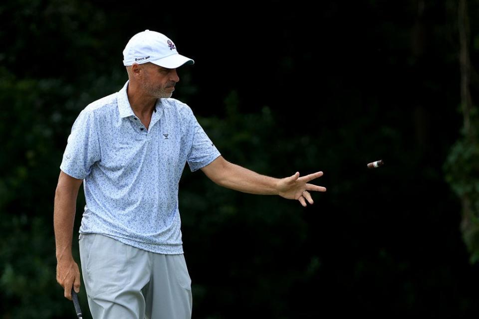 Rocco Mediate tosses his cigar on the ground at the fourth hole of the Timuquana Country Club to hit a shot during the second round of the Constellation Furyk & Friends on Oct. 5.