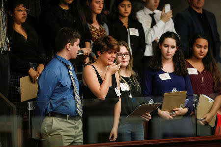 Students from Marjory Stoneman Douglas High School speak with Florida state legislators, following last week's mass shooting on their campus, in Tallahassee, Florida, U.S., February 20, 2018. REUTERS/Colin Hackley