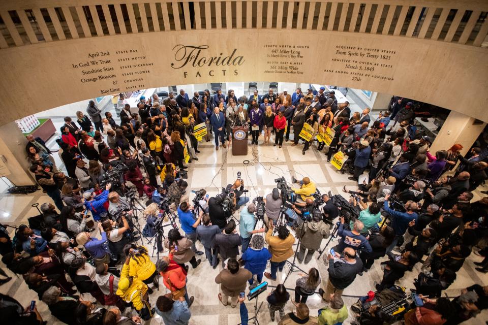 A large crowd gathered in the Florida Capitol fourth floor rotunda for the "Stop the Black Attack" in January. Attorney Ben Crump threatened to file a lawsuit against Gov. Ron DeSantis and his administration over the ban of an Advanced Placement course on African American Studies in Florida high schools on behalf of three Leon County school students.