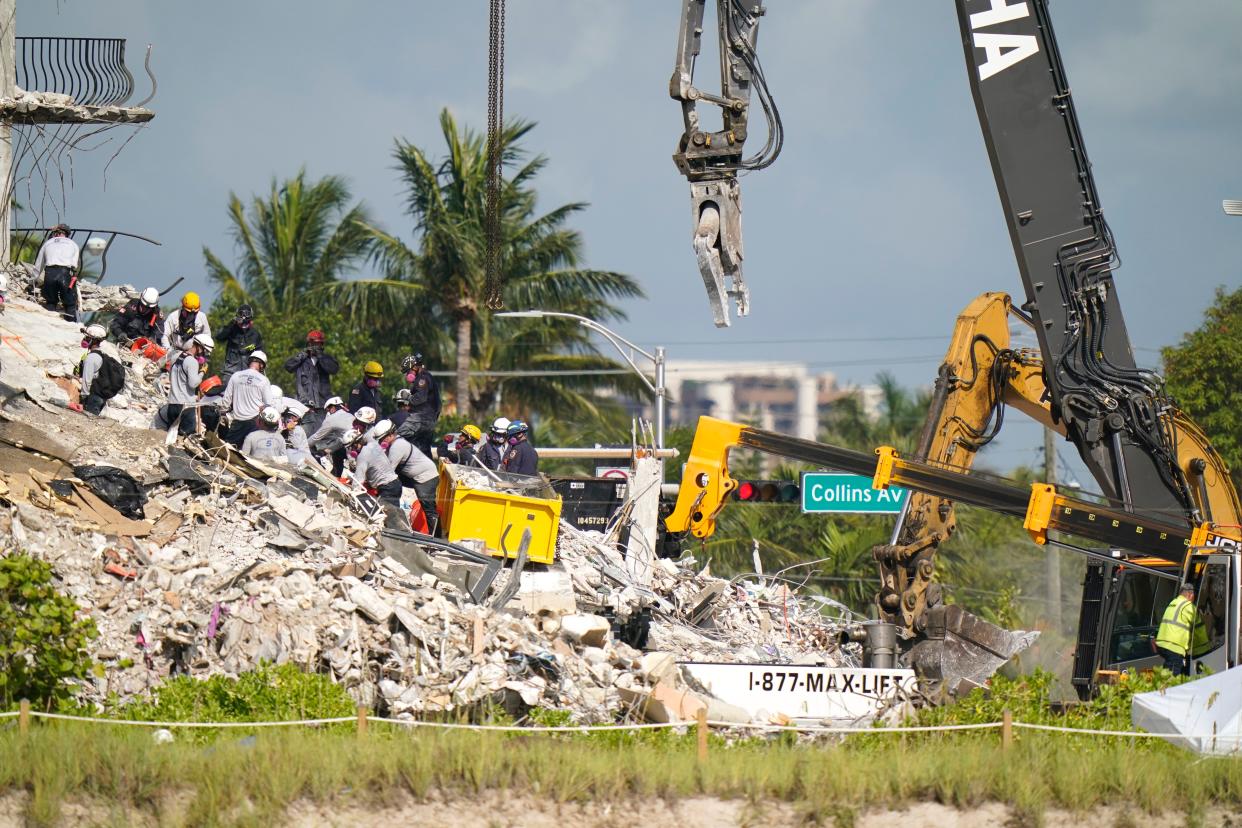 Rescue workers search in the rubble at the Champlain Towers South condominium on Monday, June 28, 2021, in the Surfside area of Miami.