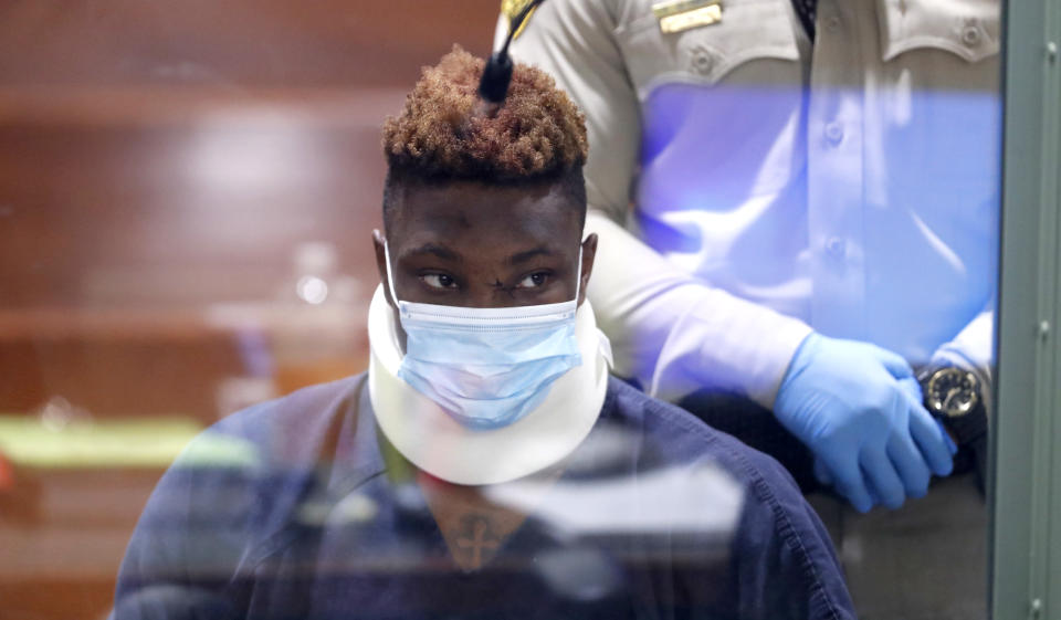 LAS VEGAS, NEVADA - NOVEMBER 3: Former Las Vegas Raiders wide receiver Henry Ruggs III makes an initial appearance in Las Vegas Justice Court on November 3, 2021 in Las Vegas, Nevada. Ruggs is facing charges relating to a fiery vehicle crash early Tuesday in Las Vegas that left a woman dead and Ruggs and his female passenger injured. The photo is taken through a glass window. (Photo by Steve Marcus-Pool/Getty Images)