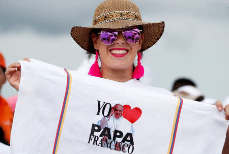 Faithful holds a t-shirt before Pope Francis arrives to lead a mass at the Contecar harbour in Cartagena, Colombia September 10, 2017. REUTERS/Stefano Rellandini