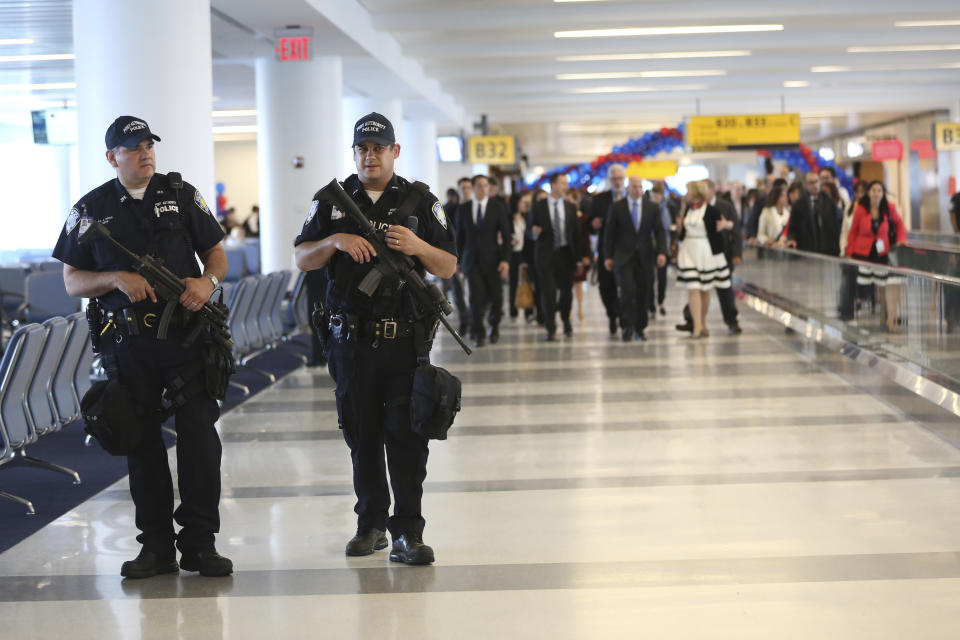 Heavily armed Port Authority police officers patrol the Delta airlines terminal 4 at JFK airport, Friday, May 24, 2013 in New York. Delta opened its $1.4 billion terminal, strengthening its hand in the battle for the lucrative New York travel market. The expanded concourse offers sweeping views of the airport, upscale food and shopping options and increased seating. It replaces a decrepit terminal built by Pan Am in 1960 that was an embarrassing way to welcome millions of visitors to the United States. (AP Photo/Mary Altaffer)