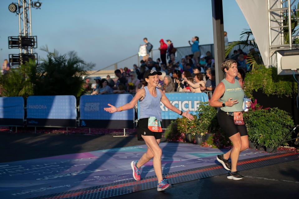 (Feb. 26, 2023) Runners crossed the finish line at the Disney Princess Half Marathon presented by CORKCICLE at Walt Disney World Resort in Lake Buena Vista, Fla., the final event during the four-day race weekend. The women-inspired event featured thousands of runners, plus entertainment and themes geared toward women throughout the weekend. (Elisa White, photographer)