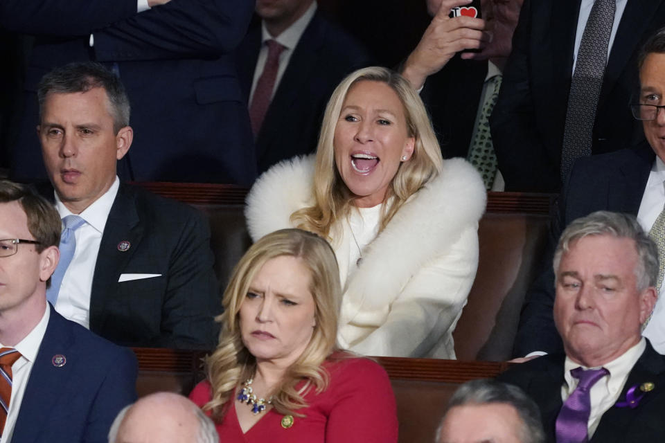 Rep. Majorie Taylor Greene, R-Ga., center, listens and reacts as President Joe Biden delivers his State of the Union speech to a joint session of Congress, at the Capitol in Washington, Tuesday, Feb. 7, 2023. (AP Photo/J. Scott Applewhite)