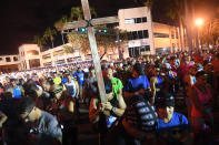 <p>Some of the 6,000 runners in the Publix A1A Marathon observe a moment of silence prior to the race for the victims of the Marjory Stoneman Douglas High School shooting on Sunday, Feb. 18, 2018. (Photo: Joe Cavaretta/Sun Sentinel/TNS via Getty Images) </p>