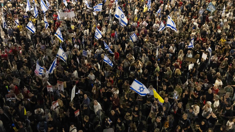 Protesters hold flags and signs during a demonstration calling for a hostages deal with Hamas and against Netanyahu and his government, in Tel Aviv, Israel on May 11. - Amir Levy/Getty Images