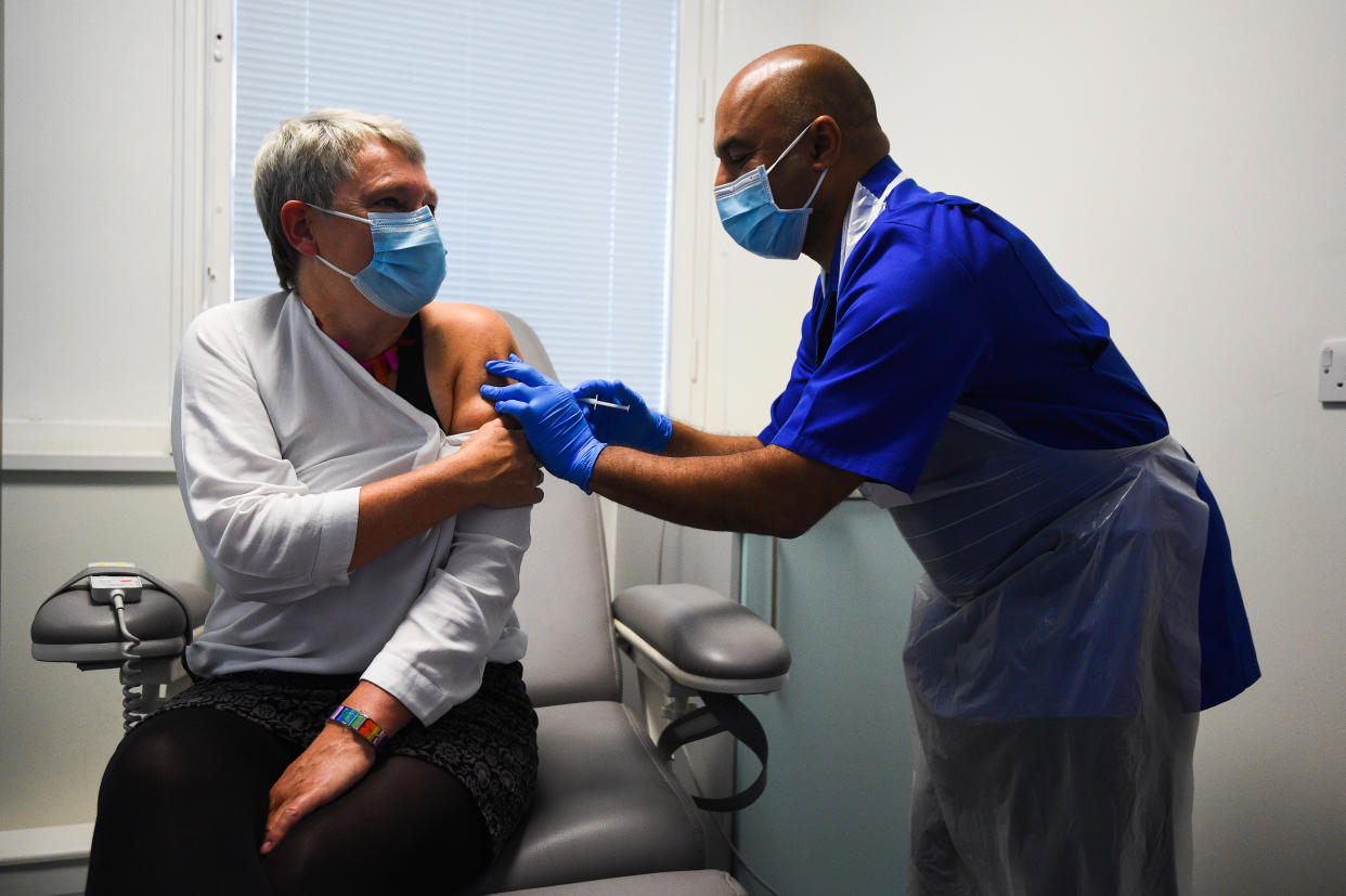 Lead research nurse Vash Deelchand gives a demonstration of the vaccine trial process as Kate Bingham, Chair of the Government's Vaccine Taskforce, starts her Novavax trial at the Royal Free Hospital, north London. (Photo by Kirsty O'Connor/PA Images via Getty Images)