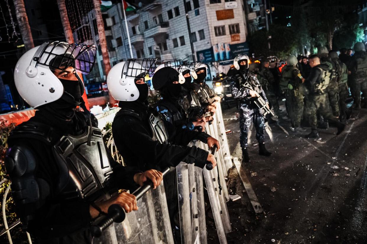 Palestinian Authority riot police take control after clearing out protesters in Ramallah, Occupied West Bank.