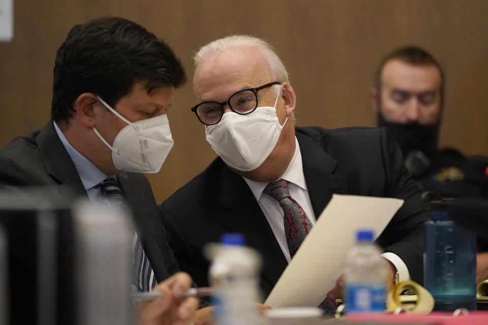 Andras Farkas, left, talks with Pat Harris, both attorneys representing Scott Peterson, at the San Mateo County Superior Court in Redwood City, Calif., Thursday, Aug. 11, 2022. Peterson is in court for a hearing to determine whether he gets a new trial in the murder of his pregnant wife because of juror misconduct. (AP Photo/Jeff Chiu, Pool)