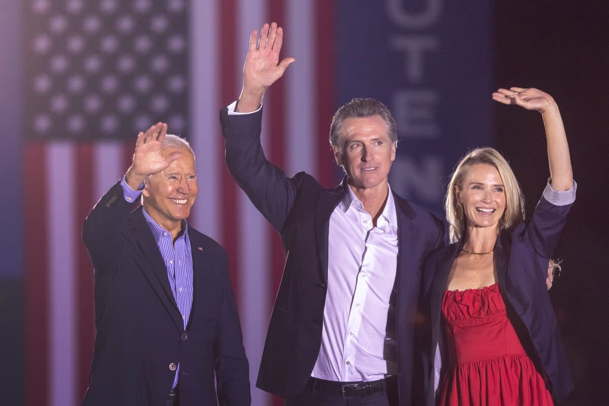 U.S. President Joe Biden, California Gov. Gavin Newsom and Jennifer Siebel Newsom wave to the crowd as they campaign to keep the governor in office at Long Beach City College on the eve of the last day of the special election to recall the governor on September 13, 2021 in Long Beach, California. (Getty Images)