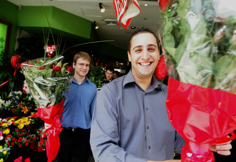 Men purchase flowers from a florist on Valentine’s Day, February 14, 2008 in Sydney, Australia. Image: Getty