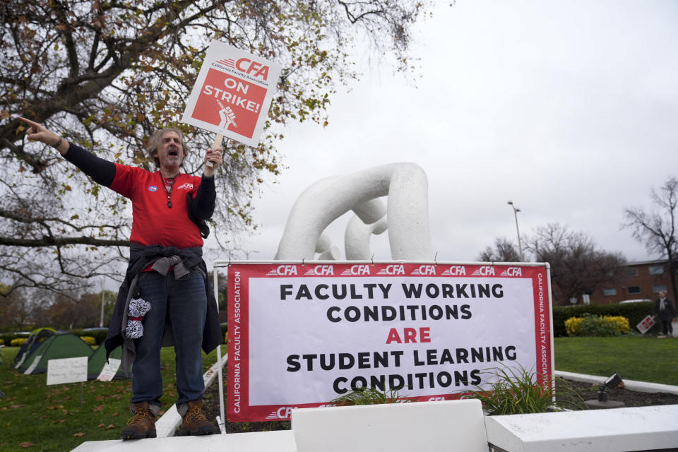 Charles Hatfield, an English professor, pickets outside the Cal State Northridge campus Monday, Jan. 22, 2024, in Northridge, Calif. More than 30,000 professors, librarians, plumbers, electricians, and other workers at California State University, the largest public university system in the U.S., have started a weeklong strike on Monday to demand higher wages. (AP Photo/Marcio Jose Sanchez)