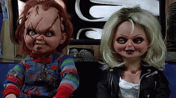 Chucky and Tiffany from Bride of Chucky smile at each other