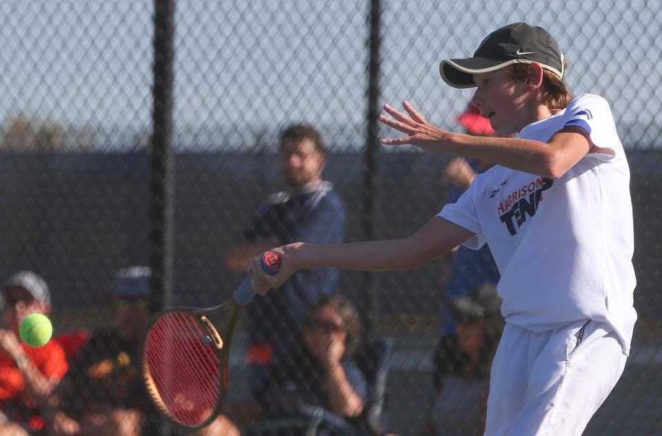 Harrison tennis player Alexander Young hits the ball Thursday, Oct. 3, 2024, during the IHSAA boys tennis sectionals championship at Harrison High School in West Lafayette, Ind. West Lafayette won 3-2.