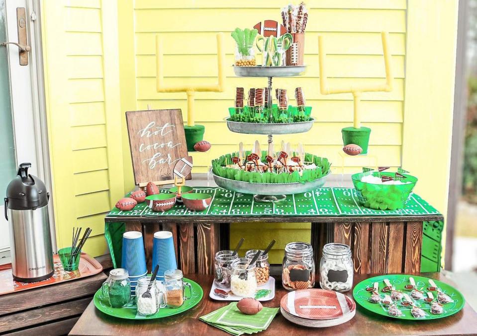 Table set up with Super Bowl party decor and snacks