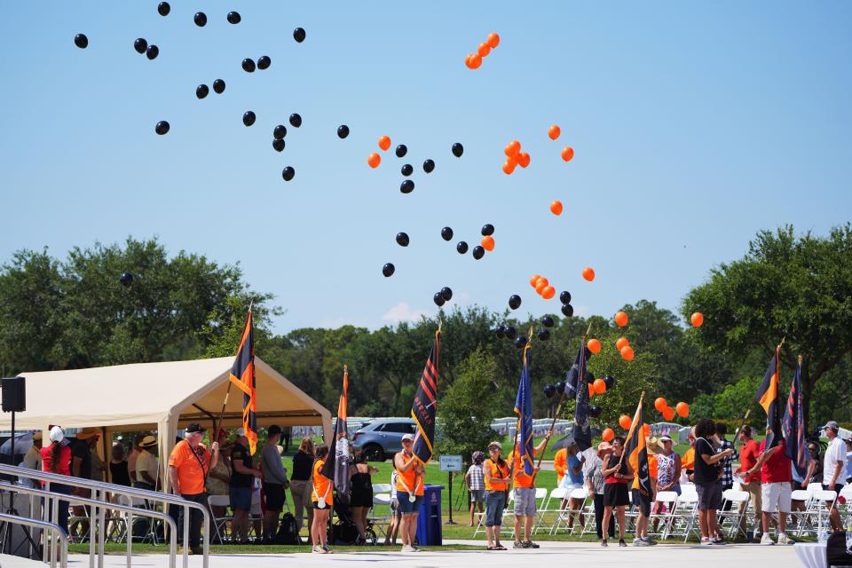 Balloons are released to bring awareness to those veterans that died due to exposure to the Vietnam War era exfoliant Agent Orange and more recently burn pits during the 18th Annual Memorial Day ceremony at the South Florida National Cemetery on Monday, May 27, 2024, near Lake Worth Beach.