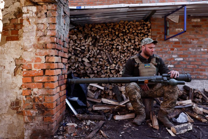 Anti-aircraft unit serviceman of the 10th Mountain Assault Brigade, call sign "Chub", 34, prepares to pose for a portrait with a portable anti-aircraft missile system