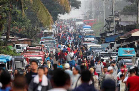 Residents wait in queue at a military checkpoint before they were allowed to return to their homes for the first time since the battle between government troops and Islamic State militants began in May last year, in the Islamic city of Marawi, southern Philippines April 19, 2018. Picture taken April 19, 2018. REUTERS/Erik De Castro