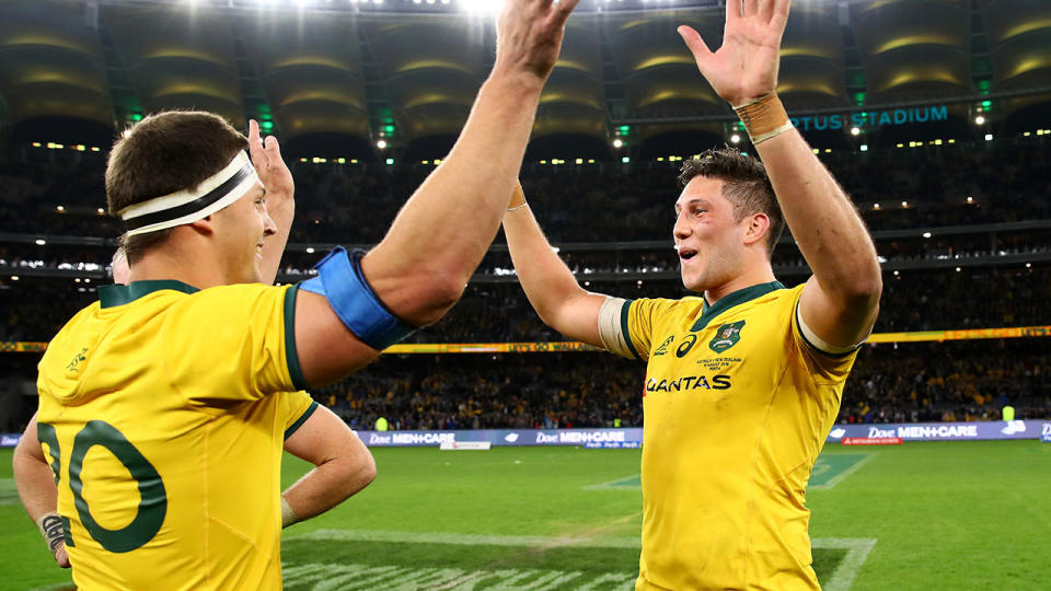 Wallabies stars Luke Jones and Adam Coleman celebrate. (Photo by Cameron Spencer/Getty Images)