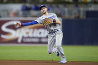 Los Angeles Dodgers shortstop Trea Turner throws to first for the out on San Diego Padres' Jake Cronenworth during the seventh inning in Game 3 of a baseball NL Division Series, Friday, Oct. 14, 2022, in San Diego. (AP Photo/Ashley Landis)