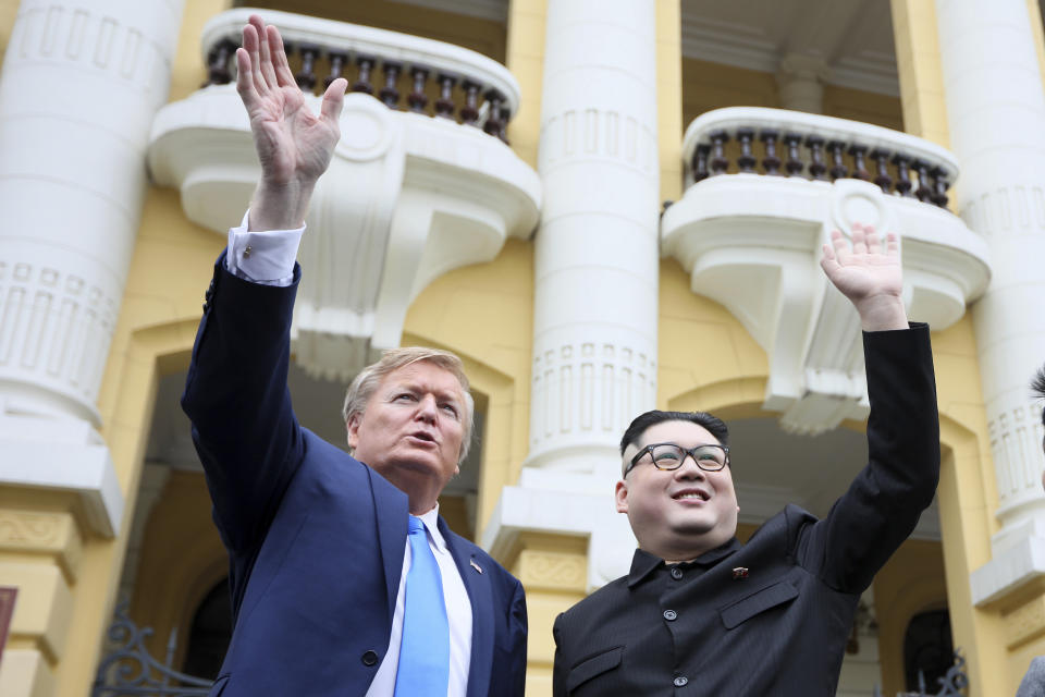 U.S. President Donald Trump impersonator Russell White, left, and Kim Jong-un impersonator Howard X pose for photos outside the Opera House in Hanoi, Vietnam, Friday, Feb. 22, 2019. The second summit between Trump and Kim will take place in Hanoi on Feb. 27 and 28. (AP Photo/Minh Hoang)