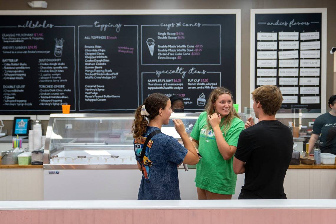 Customers in line try some samples of Andias Homemade Ice Cream in Cary, N.C. on Tuesday, Aug. 2, 2022.