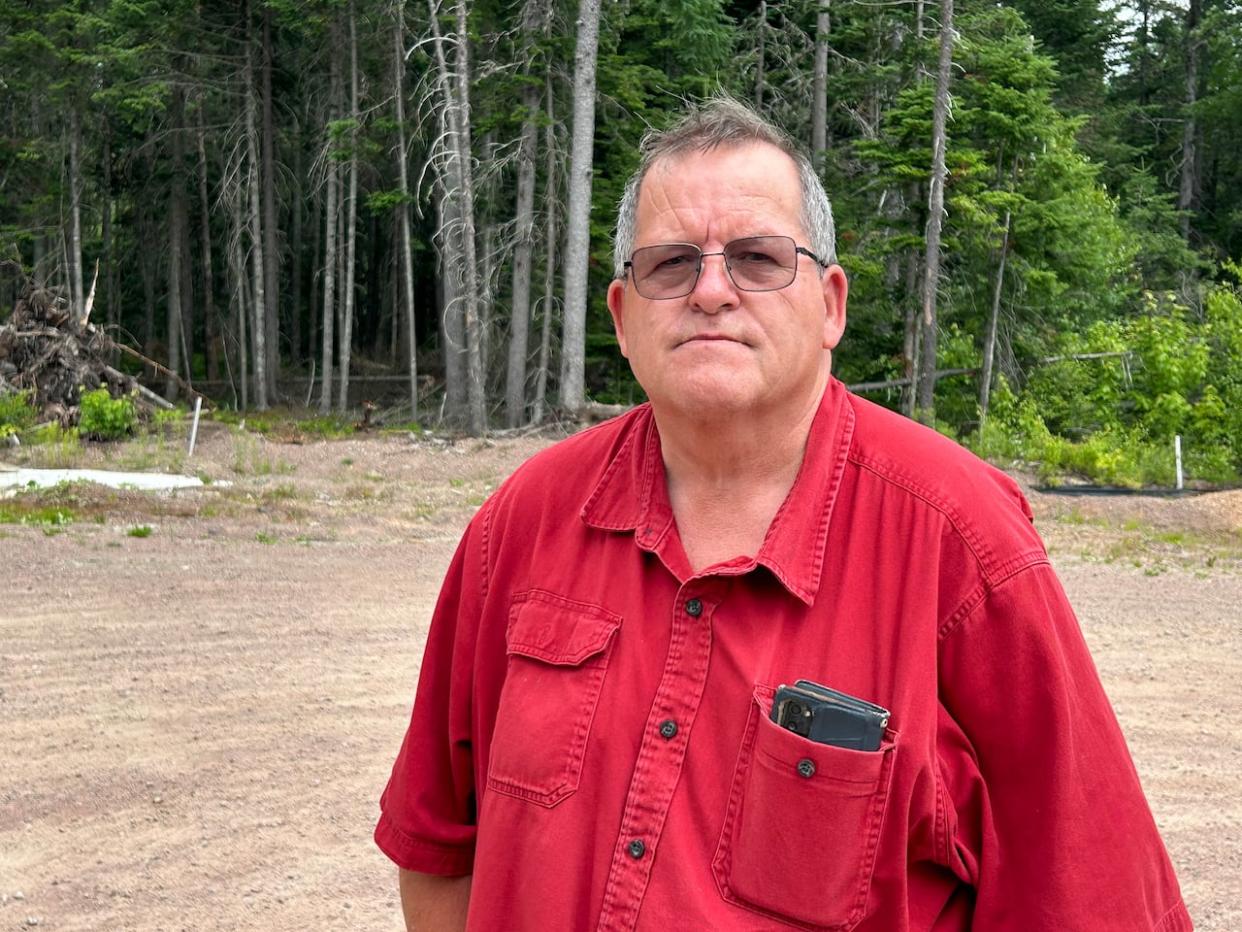 Mark Atkinson says it's unpleasant seeing dumped cement when he looks out his window. (Rhythm Rathi/CBC - image credit)