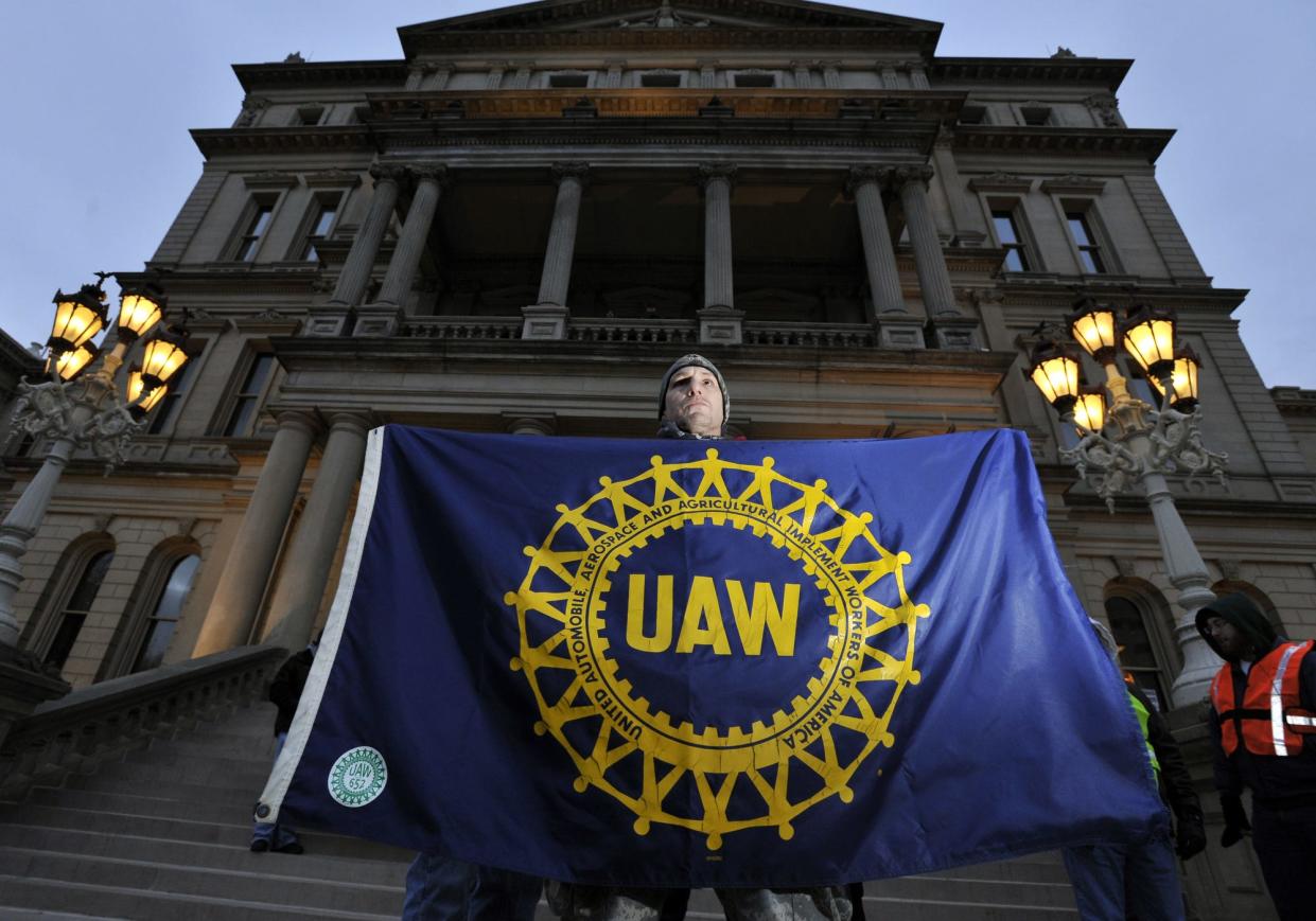 UAW Local 652 Lansing union member Jake Jacobson stands on the steps of the Capitol before the right-to-work legislation protest in Lansing on Tuesday, Dec. 11, 2012.