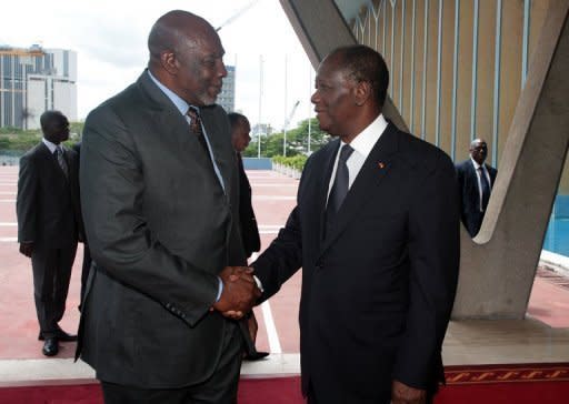 Mali's interim premier Cheick Modibo Diarra (left) is welcomed by Ivorian President Alassane Ouattara before a meeting at Abidjan's presidential palace. Ouattara is the head of the West African bloc ECOWAS. Mali's embattled transitional government has rejected a rebel alliance's declaration of an Islamic state in the vast desert north, a move that has plunged the nation closer to breakup