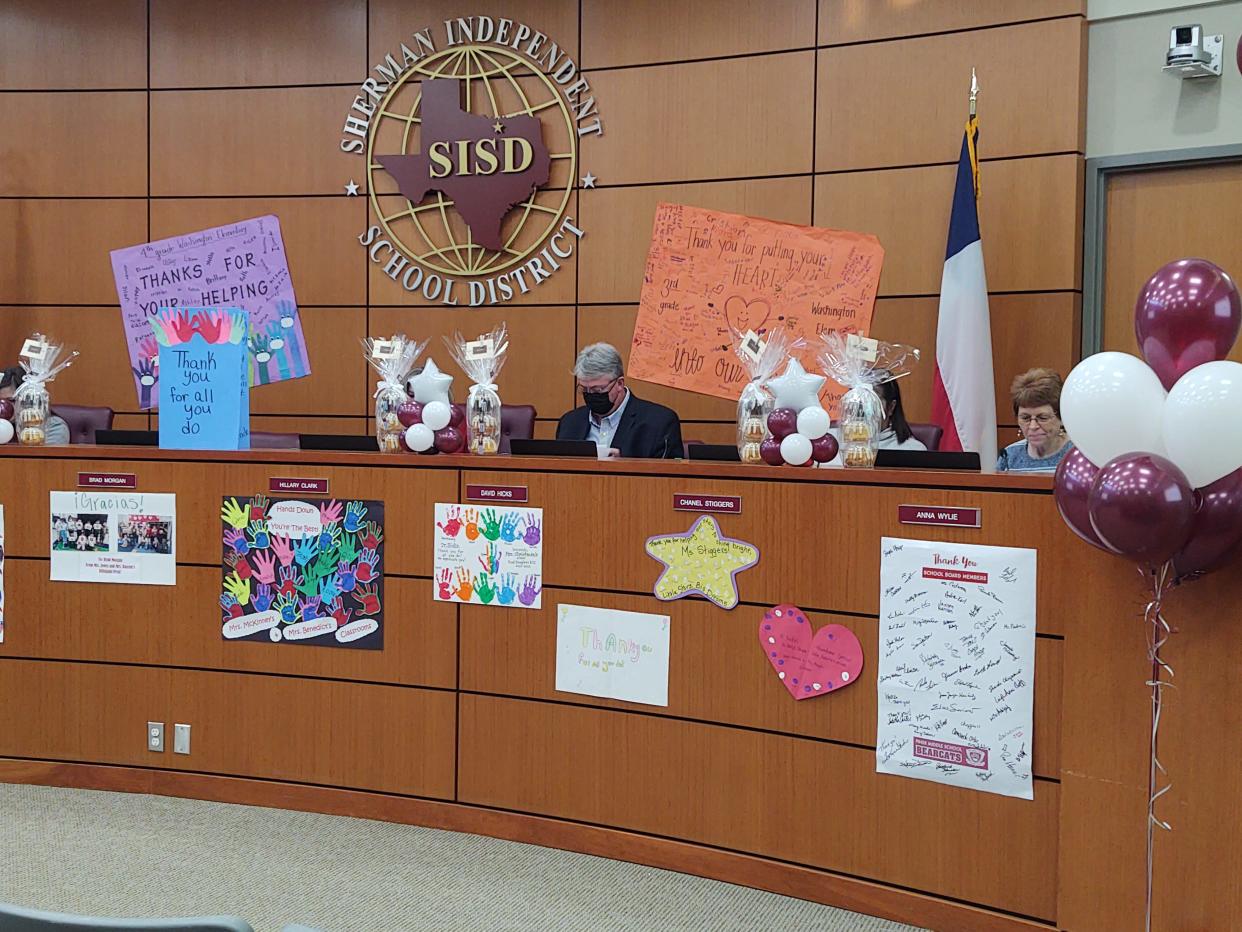 Colorful cards and signs decorate the dais of the Sherman School Board Monday as district students recognized the efforts of members of the school board. Throughout the country, January serves as  School Board Recognition Month and pays honor to those who give back to the community through service on local school boards.