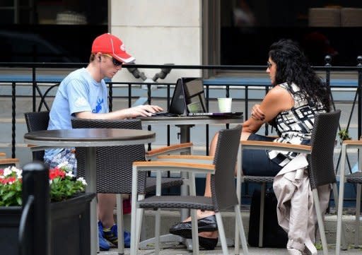 People use their laptop computers at a coffee shop in Washington DC. A Consumer Reports survey released this month found many users of Facebook are unaware of the privacy risks from the massive social network site or fail to take adequate precautions