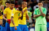 <p>Brazil’s Neymar, Miranda and team mates look dejected at the end of the match REUTERS/Toru Hanai </p>