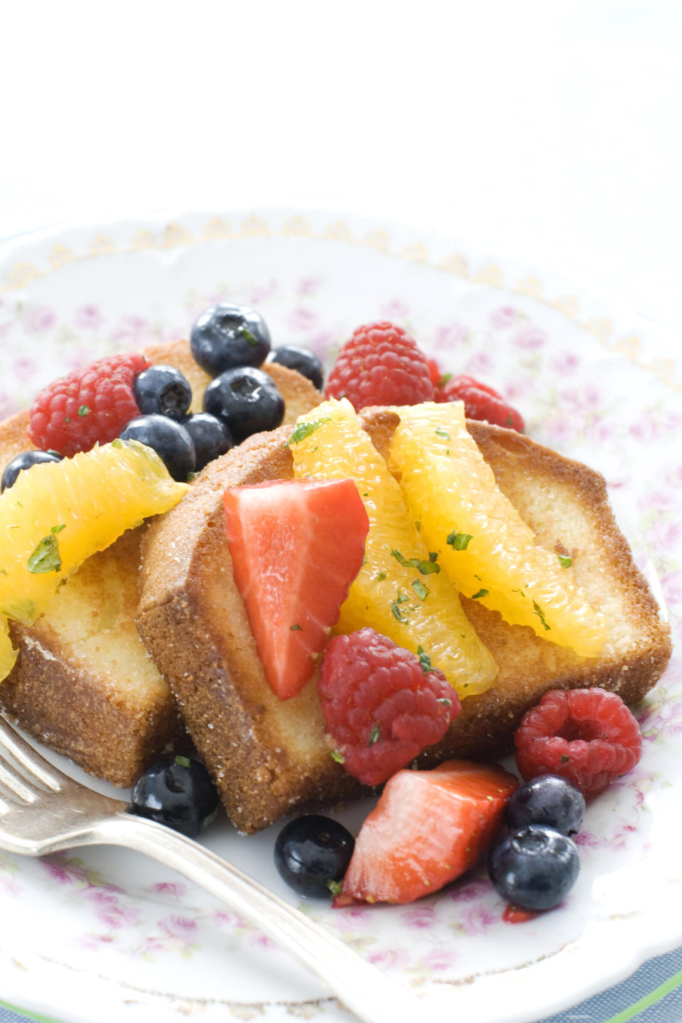 In this image taken on March 11, 2013, pan-seared pound cake with minty fruit salad is shown served on a plate in Concord, N.H. (AP Photo/Matthew Mead)