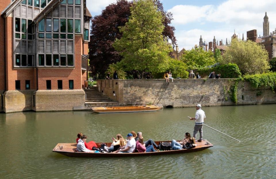 People enjoy a punt tour along the River Cam in Cambridge (Joe Giddens/PA) (PA Wire)