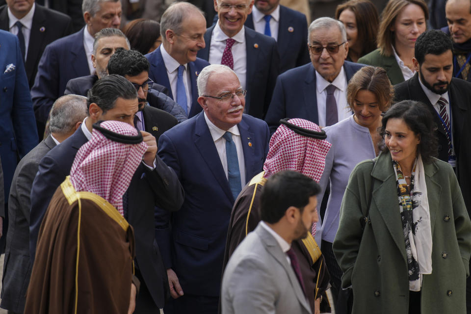 Palestinian Foreign Minister Riad al-Malki, center, arrives at the Union for the Mediterranean event in Barcelona, Spain, Monday, Nov. 27, 2023. Delegations from the European Union member states and from Middle East and northern Africa countries are meeting Monday in Barcelona, Spain, to discuss the crisis in Gaza where a fragile pause in fighting is set to expire. Forty-two delegations will gather at the Union for the Mediterranean event with many represented by their foreign ministers. Israel is not attending. (AP Photo/Emilio Morenatti)