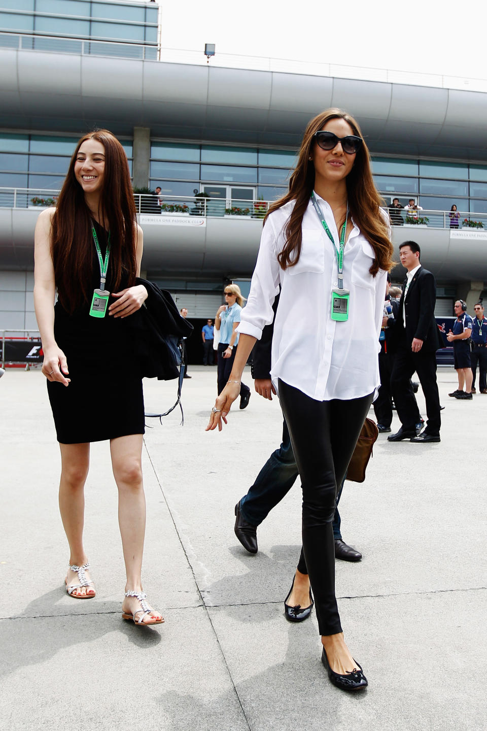 SHANGHAI, CHINA - APRIL 15: Jessica Michibata (R), girlfriend of Jenson Button of Great Britain and McLaren arrives in the paddock with her younger sister Angelica Michibata (L) before the Chinese Formula One Grand Prix at the Shanghai International Circuit on April 15, 2012 in Shanghai, China. (Photo by Paul Gilham/Getty Images)