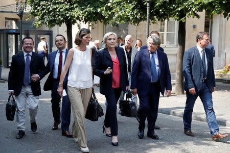 Newly-elected members of parliament (From L) Brubo Bilde, Sebastien Chenu, Emmanuelle Menard, Marine Le Pen, Gilbert Collard and Louis Aliot of France's far-right National Front (FN) political party arrive at the National Assembly in Paris, France, June 21, 2017. REUTERS/Charles Platiau