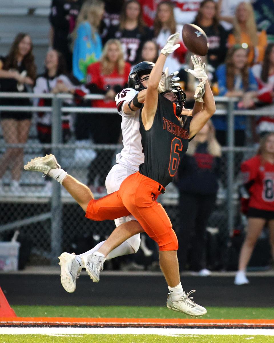 Tecumseh's Chase Findley breaks up a Pinckney pass during Friday's game in Tecumseh.