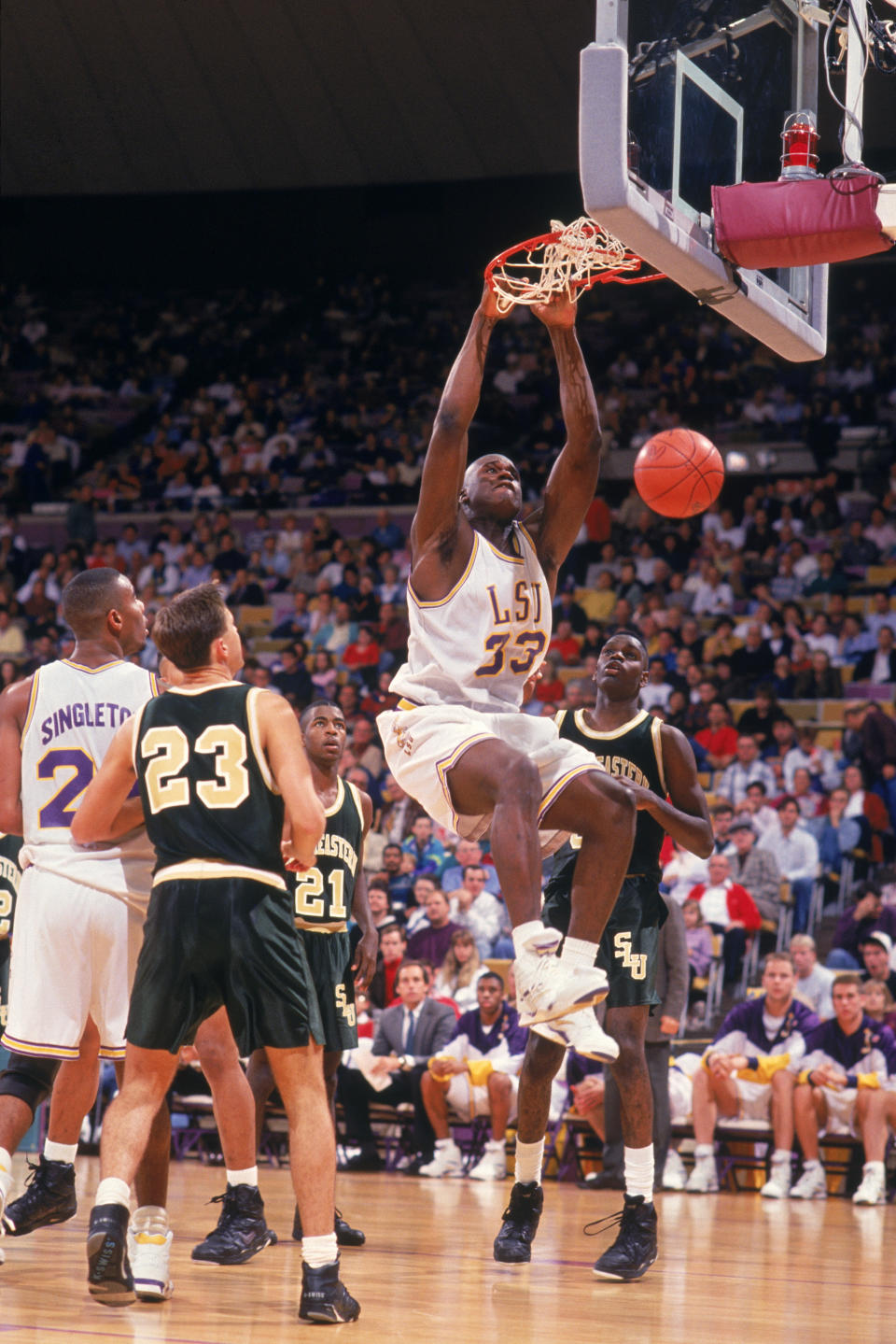 Shaquille O'Neal of the Louisiana State University Tigers makes a slam dunk during an NCAA game against the Southeastern Louisiana University LIons in 1991. (Brad Messina/Getty Images) 