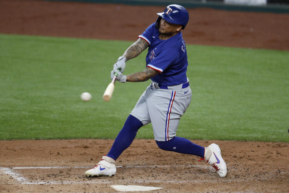 Texas Rangers' Willie Calhoun connects for a hit during an intrasquad practice baseball game at Globe Life Field in Arlington, Texas, Monday, July 6, 2020. (AP Photo/Tony Gutierrez)