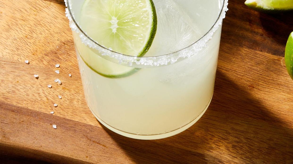 classic margaritas with a salt rim and lime garnish