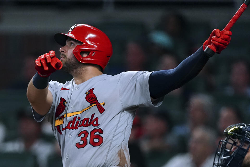 St. Louis Cardinals' Juan Yepez watches his RBI sacrifice fly during the 10th inning of the team's baseball game against the Atlanta Braves on Thursday, July 7, 2022, in Atlanta. (AP Photo/John Bazemore)