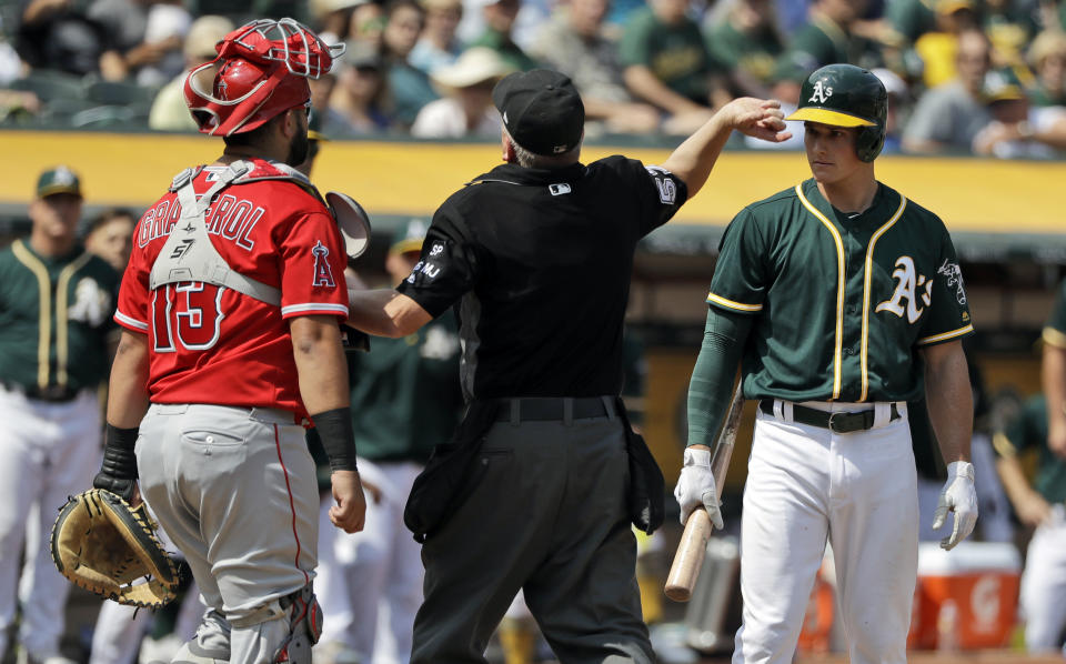 A's rookie Matt Chapman is tossed from the game by home plate umpire Mike Everitt after Chapman argued with Los Angeles Angels catcher Juan Graterol. (AP)
