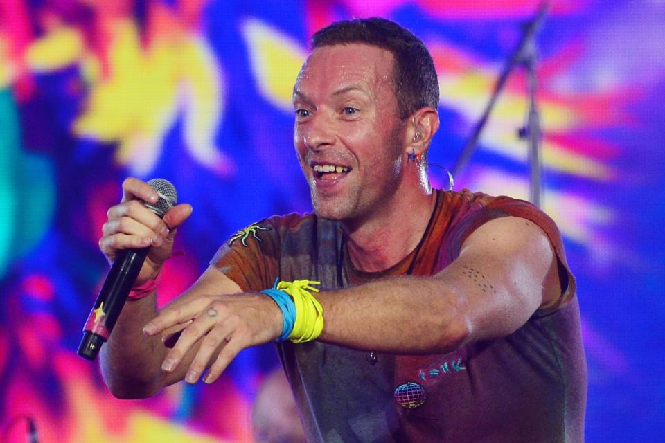 LONDON, ENGLAND - AUGUST 12: (EDITORIAL USE ONLY) Chris Martin of Coldplay performs on stage at Wembley Stadium during the 'Music of the Spheres' World Tour on August 12, 2022 in London, England. (Photo by Jim Dyson/Getty Images)