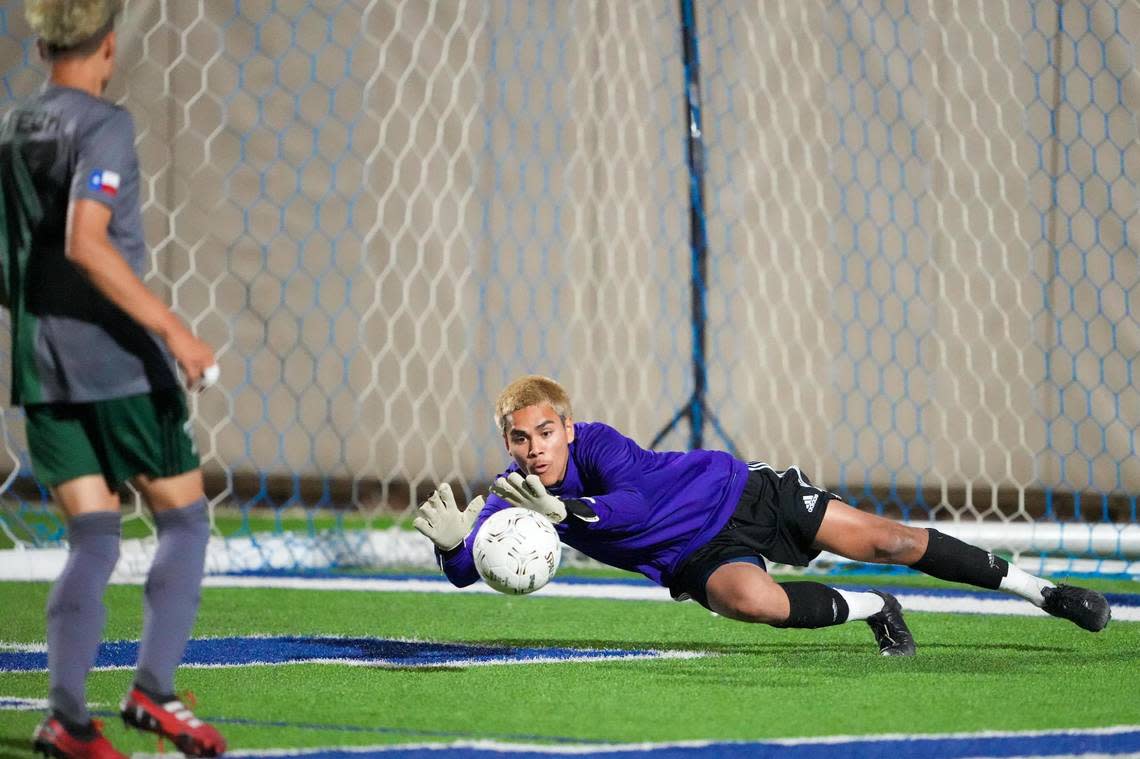 Fort Worth Trimble Tech goalkeeper Aaron Ceja makes a save against Frisco Wakeland April 14, 2022 (Ken Murphy/MaxPreps)