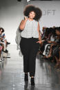 <p>A curvy model walks Loft’s show wearing a sleeveless top and black trousers at theCURVYcon during New York Fashion Week. (Photo: Getty Images) </p>