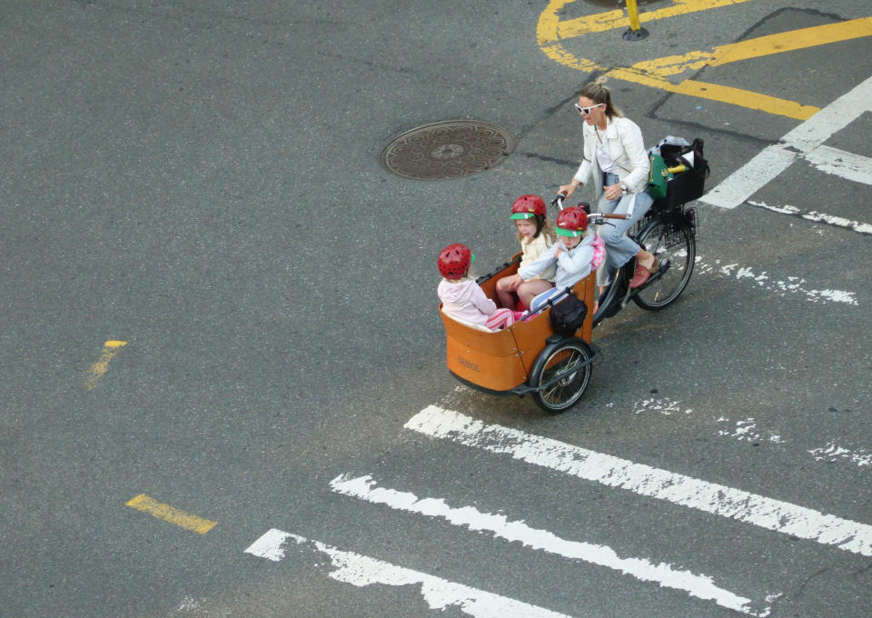 Mother and daughters commuting on Bike, New York City. (Photo by: Joan Slaking/Education Images/Universal Images Group via Getty Images)