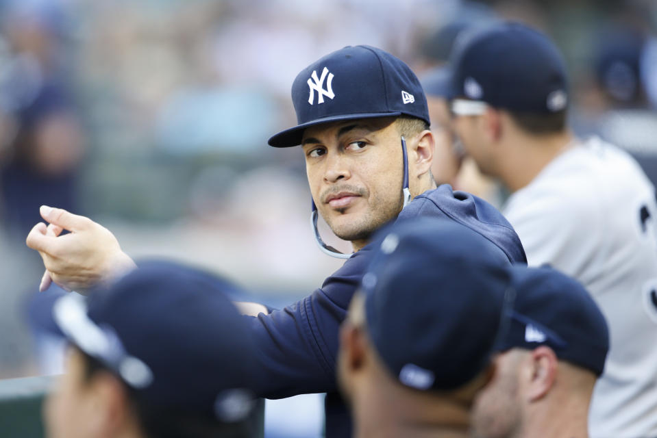 Aug 28, 2019; Seattle, WA, USA; New York Yankees outfielder Giancarlo Stanton (27) sits in the dugout during the ninth inning against the Seattle Mariners at T-Mobile Park. Mandatory Credit: Joe Nicholson-USA TODAY Sports