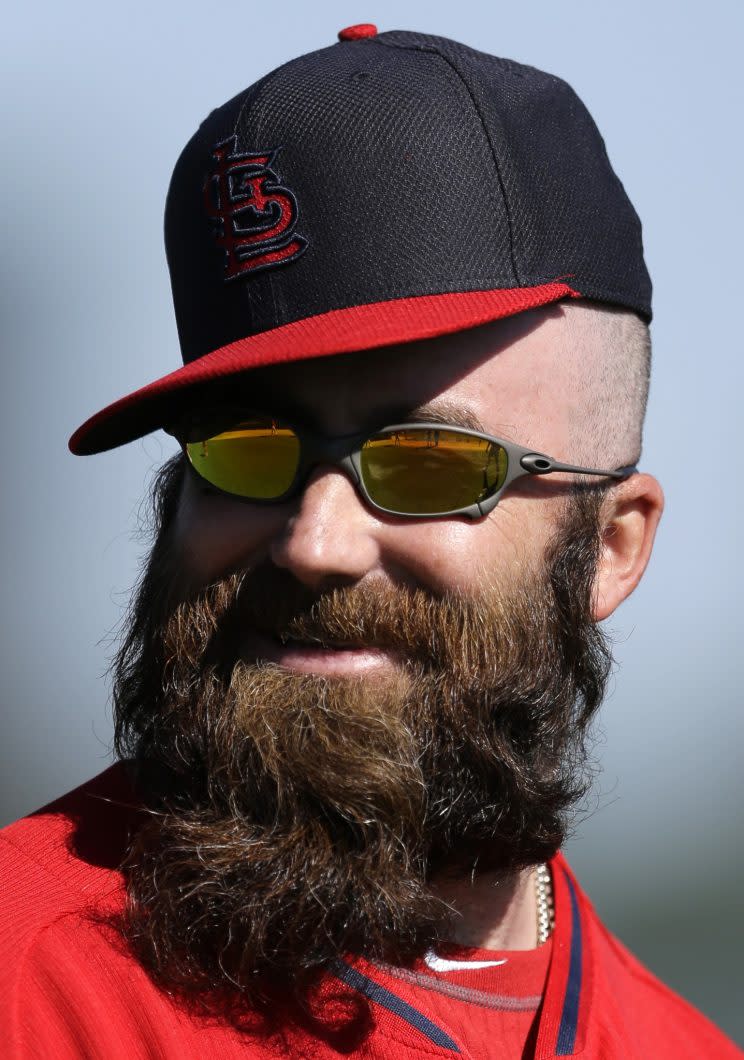 St. Louis Cardinals pitcher Jason Motte smiles while stretching at the start of a spring training baseball practice Saturday, Feb. 15, 2014, in Jupiter, Fla. (AP Photo/Jeff Roberson)